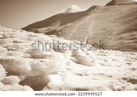 Snow covered fir trees on the background of mountain peaks. Panoramic view of the picturesque snowy winter landscape. . High quality photo Royalty-Free Stock Photo #2239949527