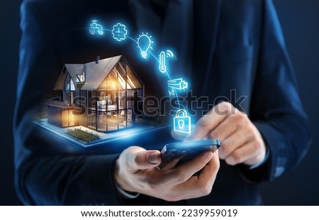 Smart home concept. Remote control and home management Royalty-Free Stock Photo #2239959019