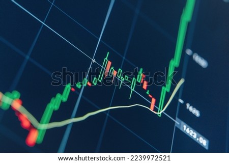 Stock market chart with green candlesticks going up indicating crypto rising in value. Graphical representation of volumes and time intervals of digital cryptocurrency past price movements Royalty-Free Stock Photo #2239972521