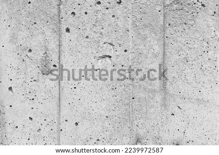 Abstract background photo texture of light gray concrete wall, close-up, front view