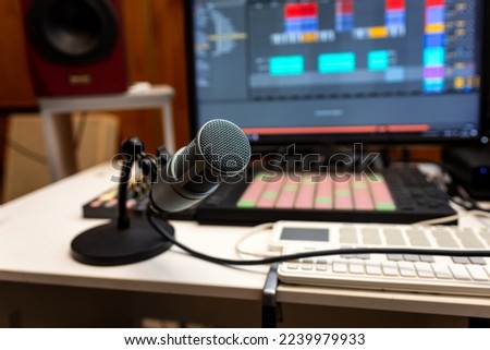 Professional microphone on a working table in a recording studio