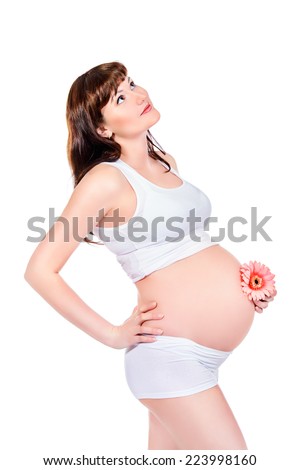 Happy pregnant woman smiling at camera. Isolated over white.
