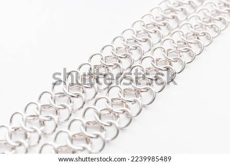decorative silver chain closeup isolated on white background
