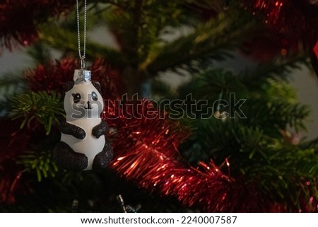 Panda hanging in a christmas tree