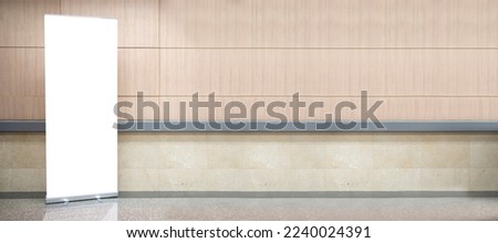 Blank roll up stand banner. Blank mockup for presentation isolated on wall background in hospital, hotel, airport.