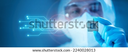 Close-up of Professional Scientist Holding a Modern Microprocessor Chip in Hand. Scientific Laboratory, Research and Development of Microelectronics and Processors. Computer Technology and Equipment. Royalty-Free Stock Photo #2240028013