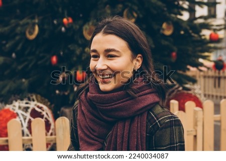 Happy woman at the Christmas market. New Year celebration