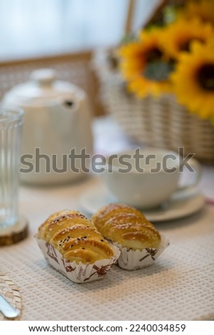 breads and coffee. Image with selective focus.Classic style espresso shot with chip muffin