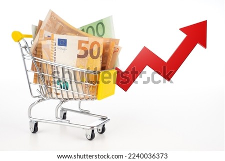 Rising euro chart. Cart with money. Red Arrow near cart from supermarket. Concept of rising food prices. Trolley with banknotes isolated on white. Metaphors for inflation in euro area