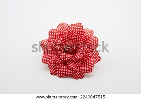 Flamenco fabric flower, isolated on white Royalty-Free Stock Photo #2240047515