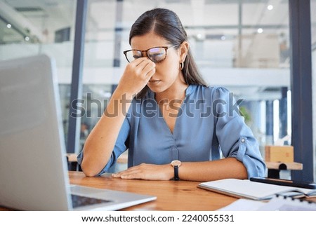 Stress headache, burnout and woman in office overwhelmed with workload at desk with laptop. Frustrated, overworked and tired woman with computer at startup, anxiety from deadline time pressure crisis Royalty-Free Stock Photo #2240055531