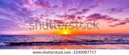 A Divine Surreal Colorful Ocean Sunset With Sun Rays In Banner Image Format Royalty-Free Stock Photo #2240087717