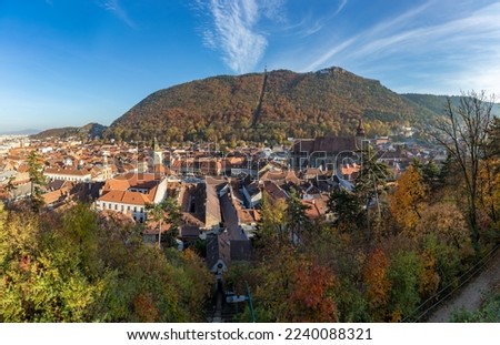 A picture of the city of Brasov and the nearby landscape, namely the Tampa hill, in the fall.