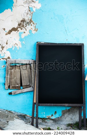 Empty old menuboard on a street