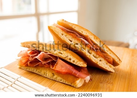 Spanish ham Dorayaki. Dorayaki is a type of Japanese sweet that consists of two round-shaped cakes filled with anko, which is a bean paste made with azuki bean variant.