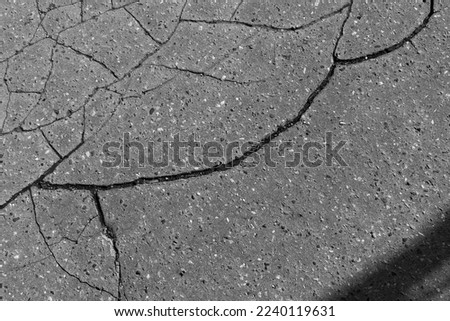 Crack on broken city street asphalt road 
