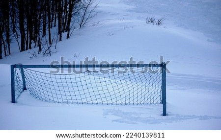 football goal covered in snow