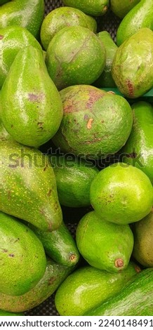 close up picture of fresh avocado in traditional market