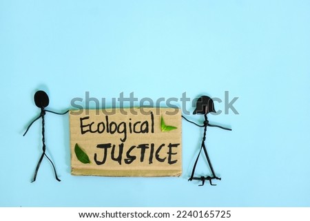 Ecological justice concept. People stick figures protesting while holding a carton placard.