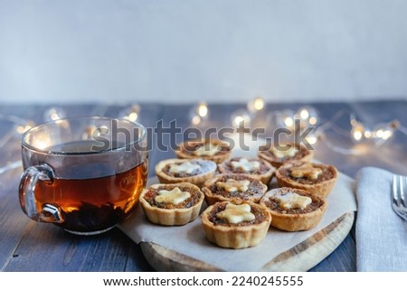 Christmas mince pies with fruit filling on a gray background. Fragrant pies for tea. English traditional pastry.