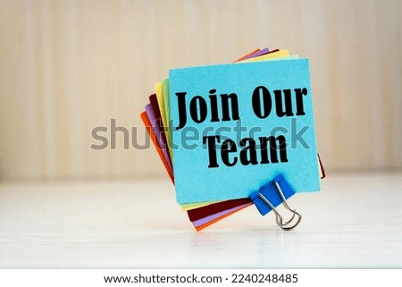 Join our team written on color sticker notes blur background.