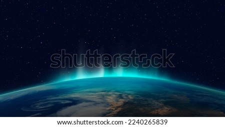 Northern lights aurora borealis over planet Earth "Elements of this image furnished by NASA" Royalty-Free Stock Photo #2240265839