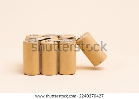 Side View of Bundle of Soldered Ni-Mh Rechargeable Batteries  Placed Together Over Beige.Horizontal Image Royalty-Free Stock Photo #2240270427