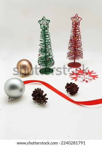 snow ball with christmas ornament over white background