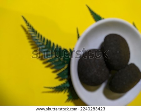 blurred black bread with yellow background for template