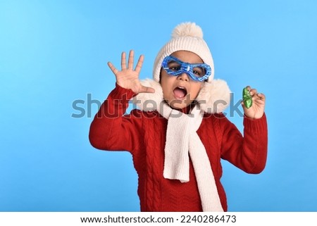 Portraits of happy young kid boy celebrating christmas 