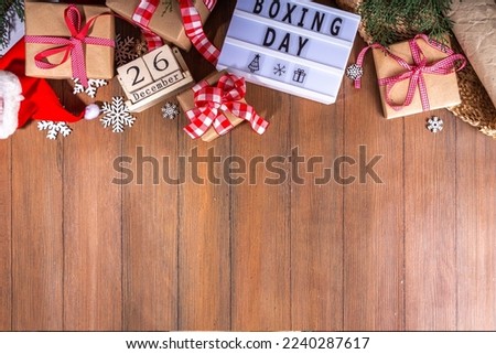 Boxing day sale seasonal promotion background. Various presents gift box with ribbon, with inscription frame Boxing day, block wooden calendar, wrapping holiday paper, Christmas decor, ribbons