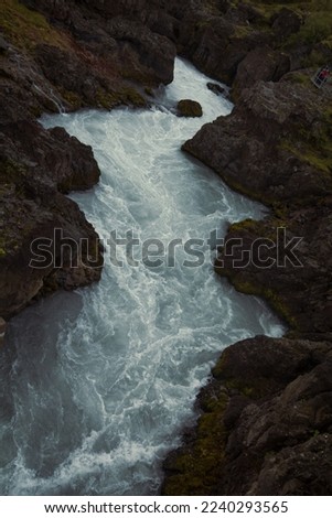 Hvita river running between rocks landscape photo. Beautiful nature scenery photography with cliffs on background. Idyllic scene. High quality picture for wallpaper, travel blog, magazine, article