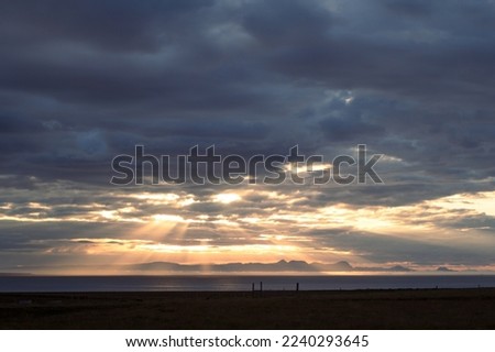 Cloudscape with bright sunbeams landscape photo. Beautiful nature scenery photography with sunset sky on background. Idyllic scene. High quality picture for wallpaper, travel blog, magazine, article