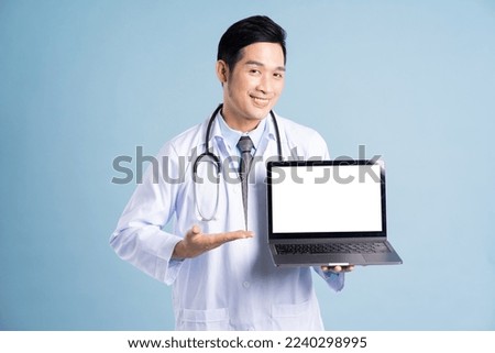Asian male doctor portrait on blue background