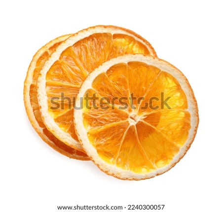 Delicious dry orange slices on white background, top view Royalty-Free Stock Photo #2240300057