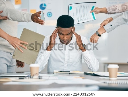 Stress, burnout and tired black man with headache, frustrated or overwhelmed by coworkers at workplace. Overworked, mental health and anxiety of exhausted male worker multitasking at desk in office. Royalty-Free Stock Photo #2240312509