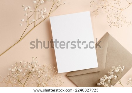 Greeting or invitation card mockup with envelope and dry flowers decor, copy space Royalty-Free Stock Photo #2240327923