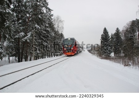 Train in snowy winter country place in cloudy day