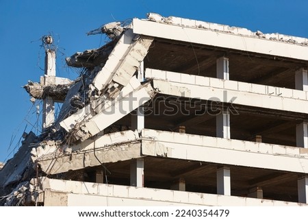 Building destroyed by earthquake. War disaster. Demolition