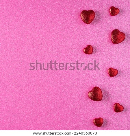 Hearts on pink background.Valentines day concept. Background with big and small hearts