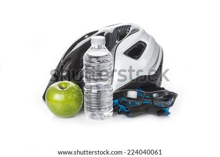 Items for a safe cycling and a healthy diet isolated on a white background
