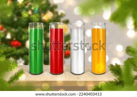 Bright glass color wax candle mock up on Christmas backgroung