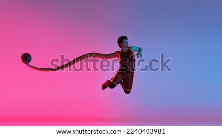 Contemporary art collage. Creative design. Sportive man, basketball player in motion, training over gradient pink blue background in neon. Inspiration, fantasy, surrealism, fashion and style. Sport.