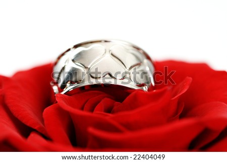 ring with hearts and red rose isolated on white