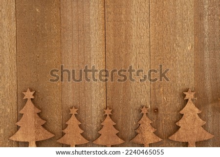 Trees on weathered wood holiday background for your winter or seasonal message