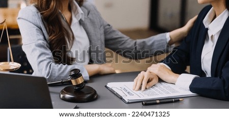 Male lawyer working with contract papers and wooden gavel on tabel in courtroom. justice and law ,attorney, court judge, concept.