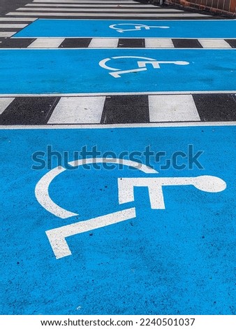 Blue parking sign of a wheelchair for disabled drivers or passengers