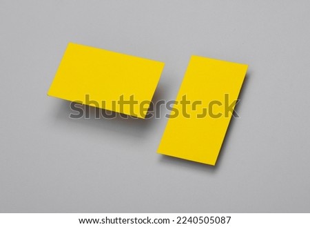 Yelow Blank business cards for corporate identity on gray background. Creative mockup.