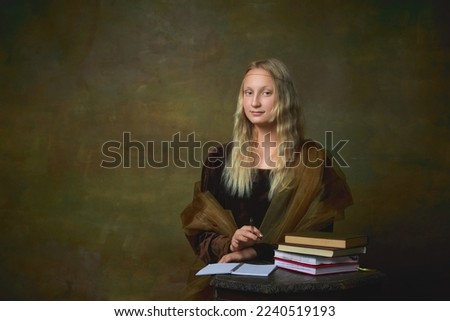 Studying. Portrait of young girl as Mona Lisa picture posing over dark vintage background. Retro style, art, fashion, comparison of eras concept. Beautiful female model as classic historical character Royalty-Free Stock Photo #2240519193