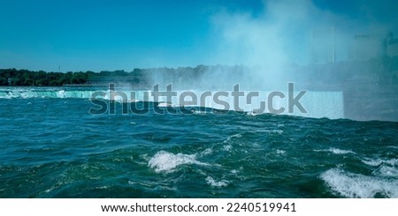 Niagara Falls Summer Travel Landscape Series, view of Canadian Side Skyline and river flowing down Horseshoe Falls in New York, USA